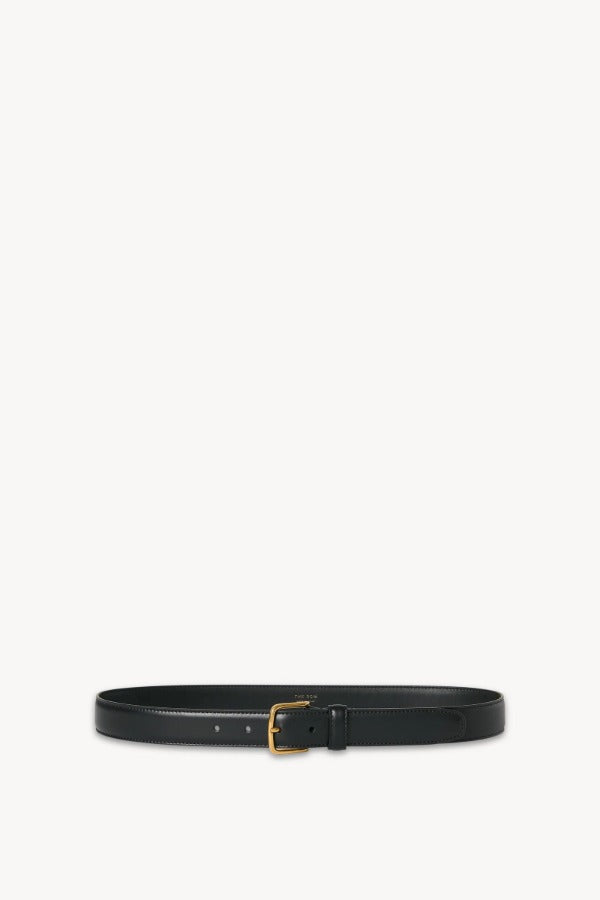 Front view of black classic belt on white background, with no model shown.