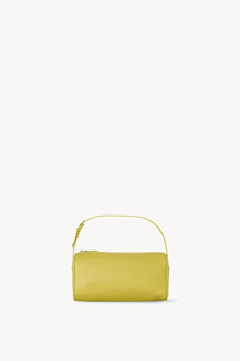 Front view of coppery yellow leather bag on white background, with no model shown.