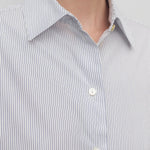 Front closeup view of blue/white cotton sisilia shirt on model, against a white background.