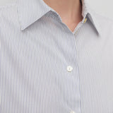 Front closeup view of blue/white cotton sisilia shirt on model, against a white background.
