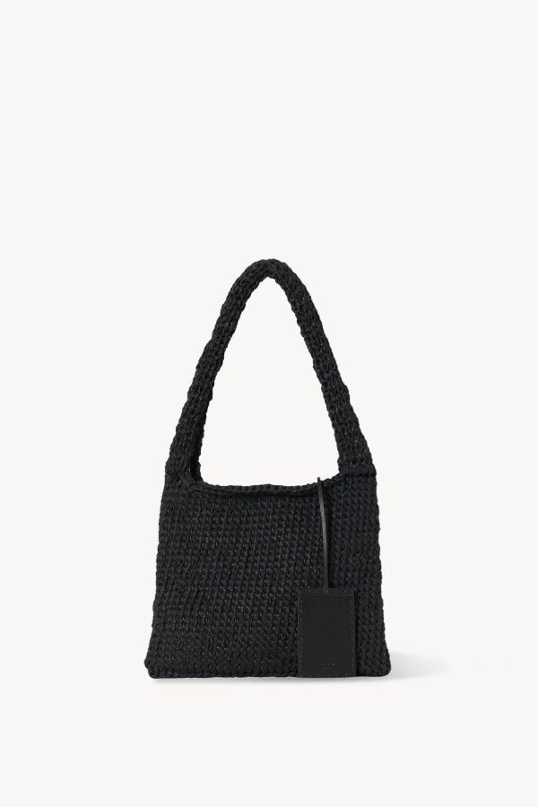 Back view of black Didion Shoulder bag on white background with no model shown.