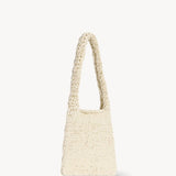 Front slanted view of ivory didion shoulder bag on white background, with no model shown.