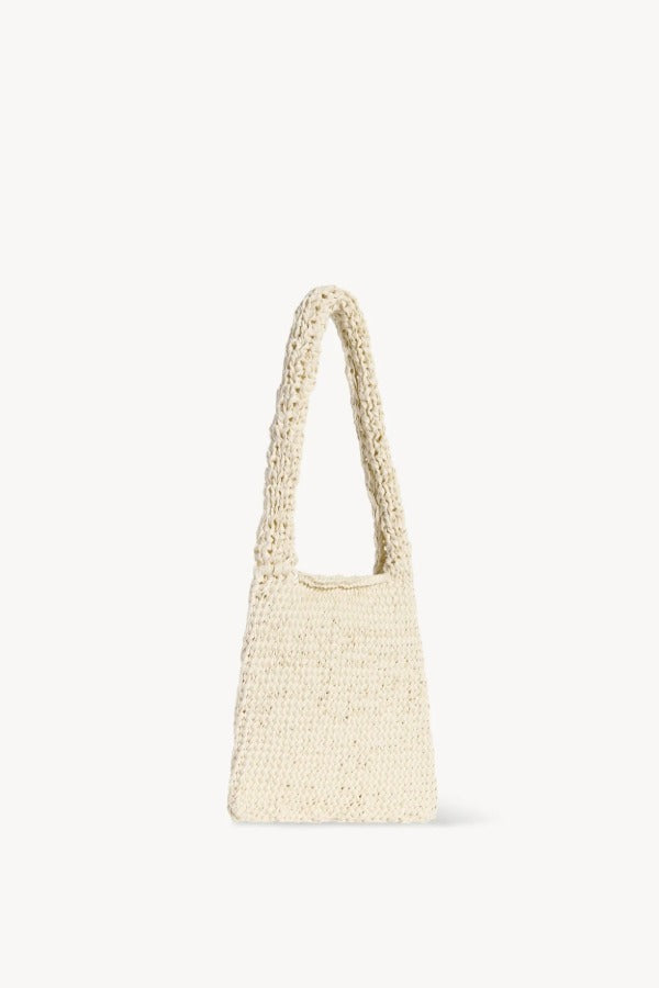 Front slanted view of ivory didion shoulder bag on white background, with no model shown.