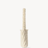 Side view of ivory didion shoulder bag on white background, with no model shown.