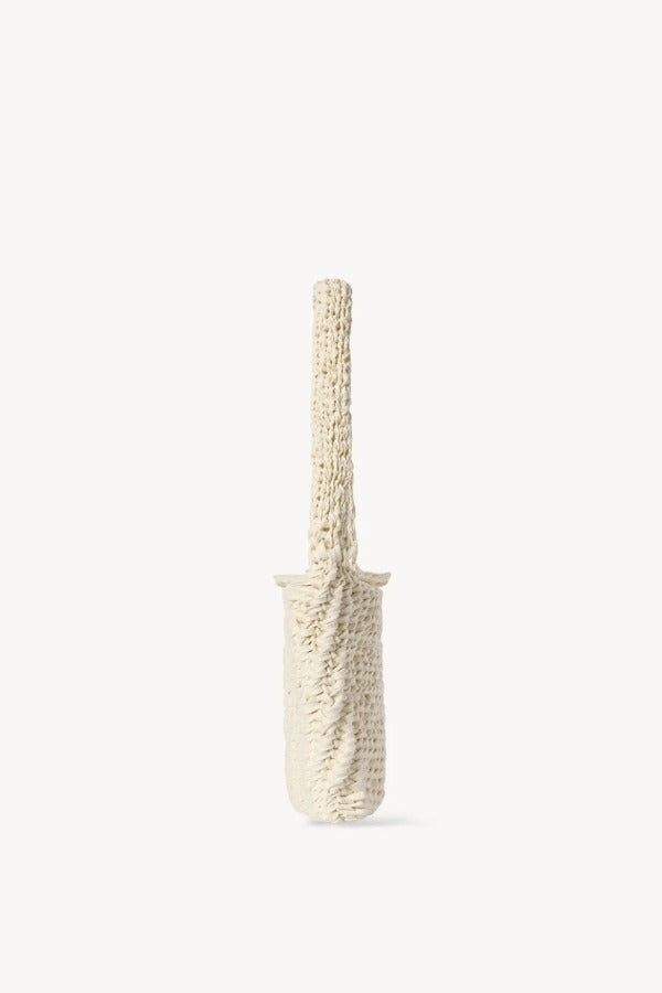 Side view of ivory didion shoulder bag on white background, with no model shown.