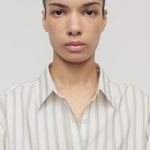 Front closeup view of grey stripe on model, against a white background.