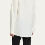 Back view of off white elke jacket on model wearing black pants, against a white background.