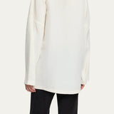 Back view of off white elke jacket on model wearing black pants, against a white background.
