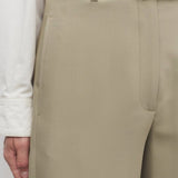 Front closeup view of fossil elowyn pant on model wearing white shirt, against a white background.