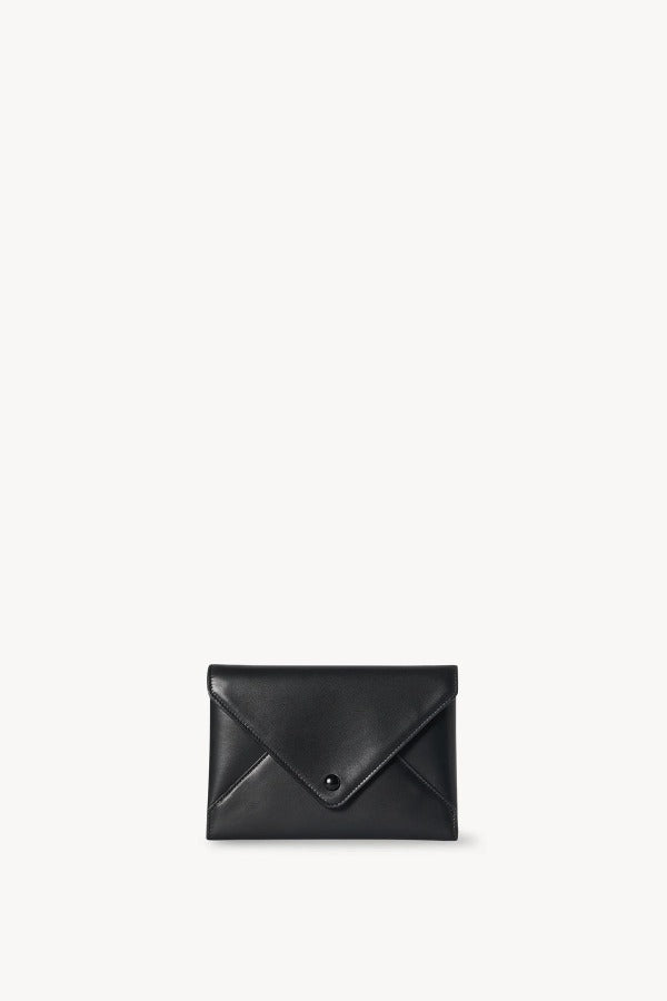 Front view of black envelope clutch on white background, with no model shown.