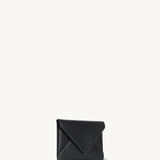 Front slanted view of black envelope clutch on white background, with no model shown.