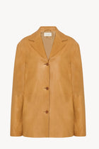 A caramel colored lambskin leather jacket, shown without model of the front facing jacket.