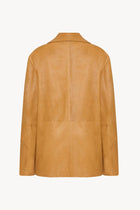 A caramel colored lambskin leather jacket, shown back facing without model.