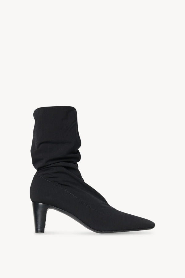 Right side view of black felice stretch boot on white background, with no model shown.