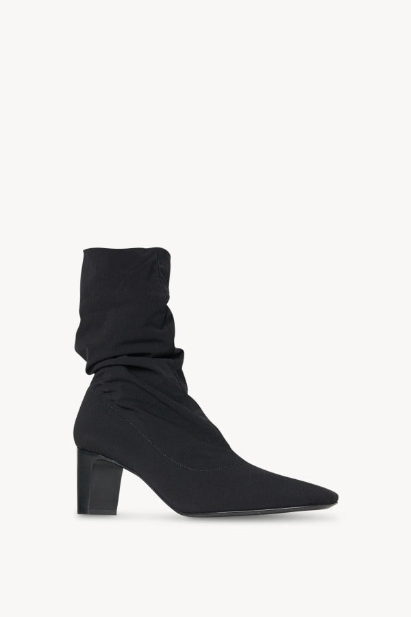 Alternate right side view of black felice stretch boot on white background, with no model shown.
