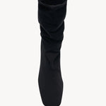 Overhead view of black felice strech boot on white background, with no model shown.