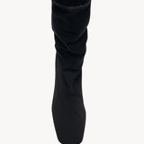 Overhead view of black felice strech boot on white background, with no model shown.