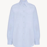 Front view of sky blue gavina shirt on white background, with no model shown.