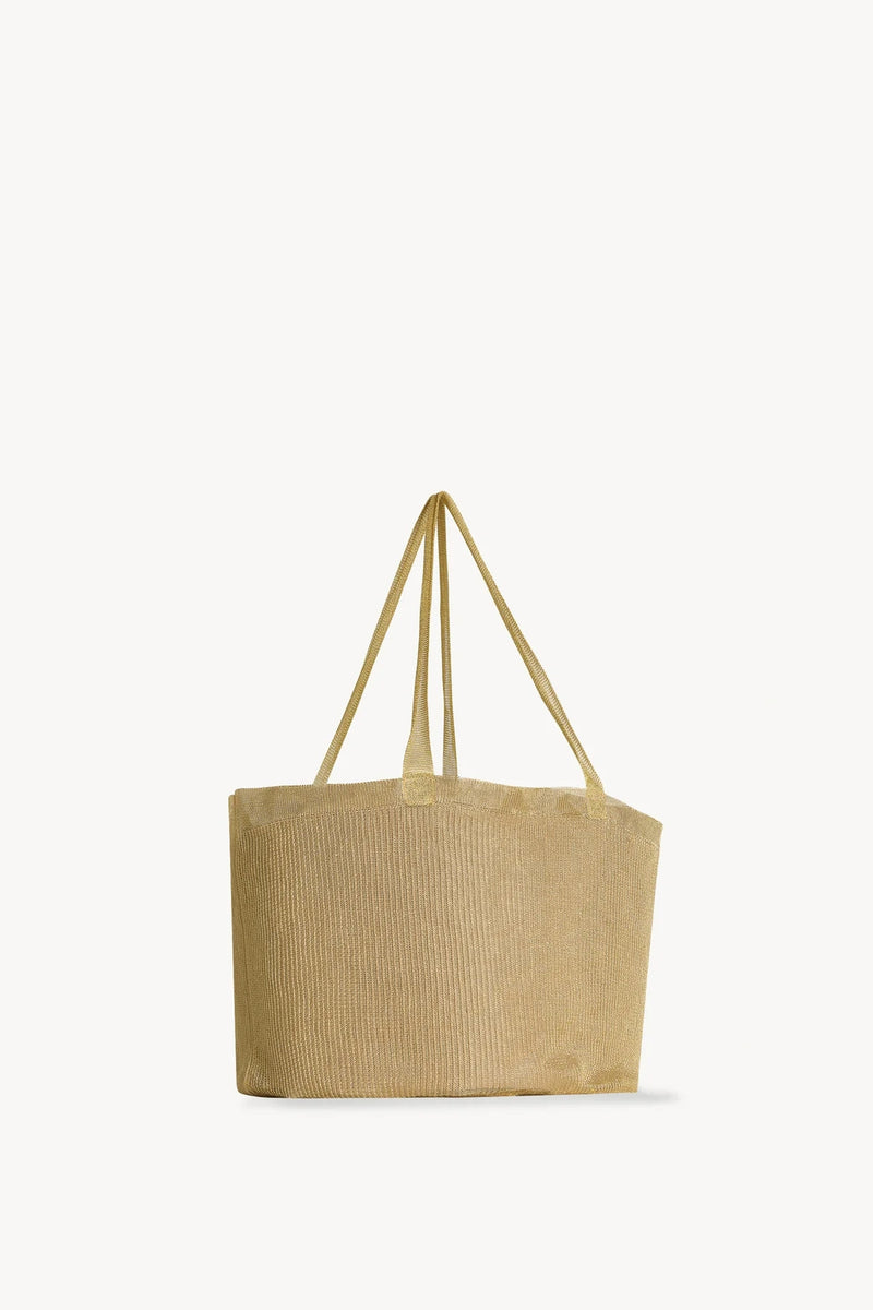 Side slanted view of gold mesh bag on white background, with no model shown.