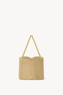 Side view of gold mesh bag on white background, with no model shown.