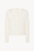 A long-sleeved white cotton button-down sweater displayed frontside on a clean white background, without a model