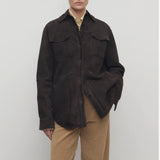 Front view of dark brown gwena jacket on model wearing khaki pants, against a white background.