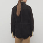 Back view of dark brown gwena jacket on model wearing khaki pants, against a white background.