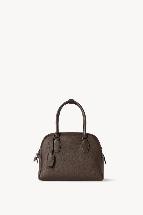 Front view of deep brown india 10 bag on white background, with no model shown.