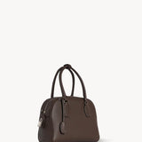 Front slanted view of deep brown india 10 bag on white background, with no model shown.