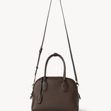 Strap view of deep brown india 10 bag on white background, with no model shown.
