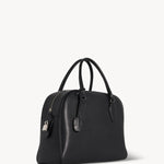 Front slanted view of black india 12 bag on white background, with no model shown.