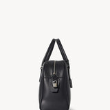 Side view of black india 12 bag on white background with no model shown.