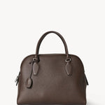Front view of deep brown india 12 bag on white background, with no model shown.