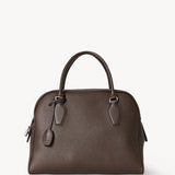Front view of deep brown india 12 bag on white background, with no model shown.