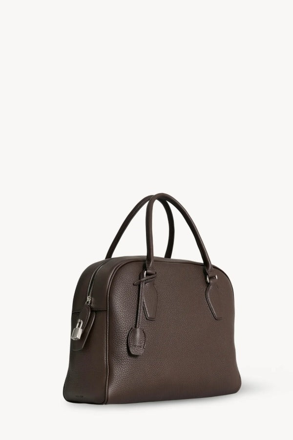 Front slanted view of deep brown india 12 bag on white background, with no model shown.