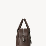 Side view of deep brown india 12 bag on white background, with no model shown.
