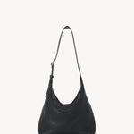 Front view of black isa shoulder bag on white background with no model shown.