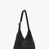 Back view of black isa shoulder bag on white background, with no model shown.