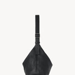 Side view of black isa shoulder bag on white background, with no model shown.