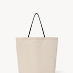Front view of the ivory mesh and leather bag is pictured on a white background, with no model shown.