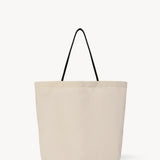 Front view of the ivory mesh and leather bag is pictured on a white background, with no model shown.