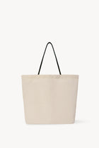 Front view of the ivory mesh and leather bag is pictured on a white background, with no model shown.