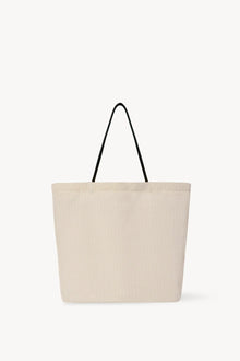 Front view of the ivory mesh and leather bag is pictured on a white background, with no model shown.