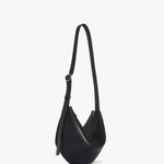 Front slanted view of black jouvette bag on white background, with no model shown.