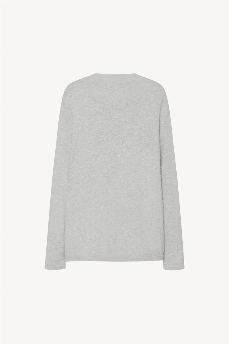 Back view of long-sleeved crew neck grey melange cotton sweater, shown without a model on a white backdrop.