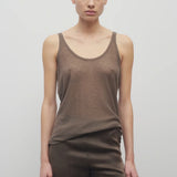 Front view of khaki kazu top on model wearing khaki pants, against a white background.