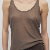 Front closeup view of khaki kazu top on model wearing khaki pants, against a white background.