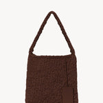 Back view of brown large didion bag on white background, with no model shown.
