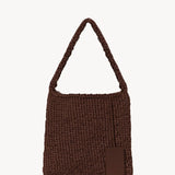 Back view of brown large didion bag on white background, with no model shown.