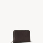 Side slanted view of dark brown large zip wallet on white background, with no model shown.